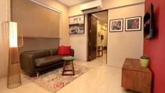 suite with living room and cushy sofa at theory9