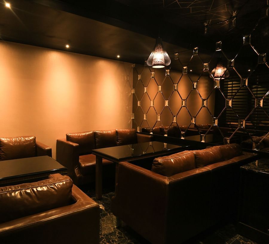 sofas inside the Lounge at Alchemy, our in-house bar in Chennai - Raj Park Hotel, Chennai