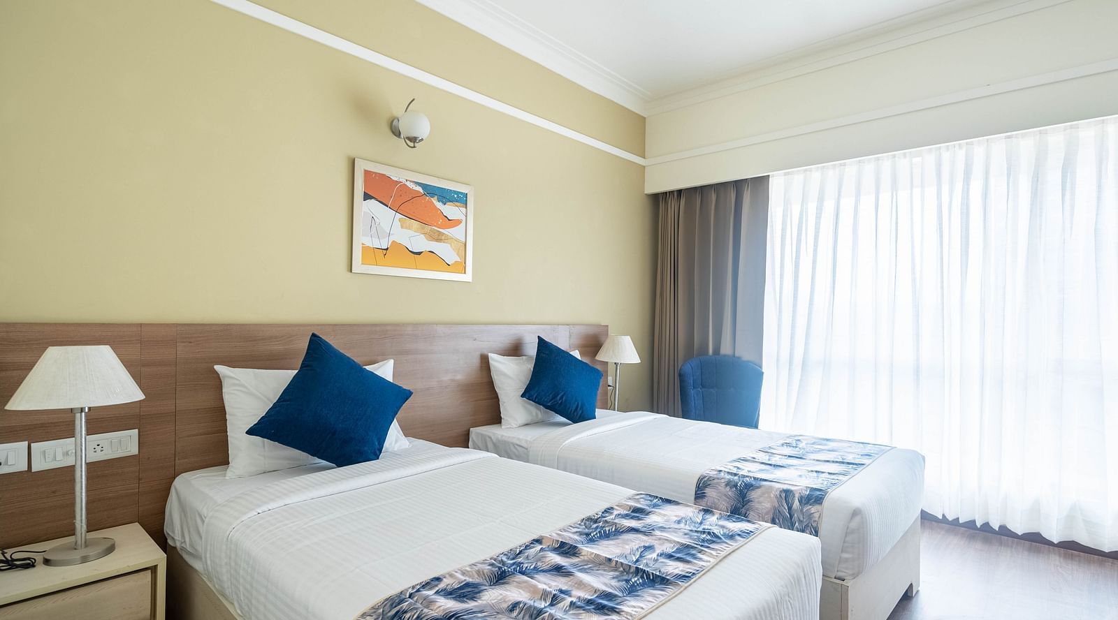 twin beds inside Deluxe One Bedroom Suite 3 - Starlit Suites Newtown, Kolkata