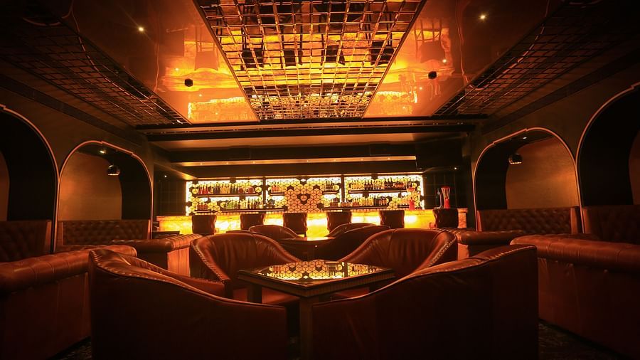 A front view of Alchemy, our bar in Chennai of the bar counter and the showcase behind it - Raj Park Hotel, Chennai