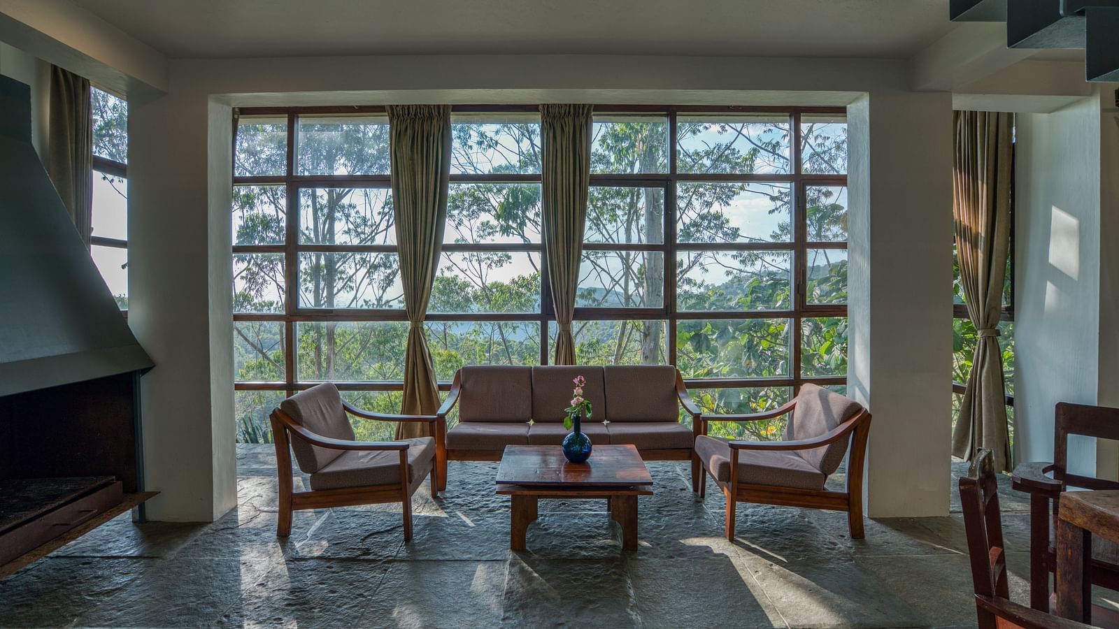 Bright living area with floor-to-ceiling windows, providing ample natural light and scenic views | Mango Hill, Yercaud
