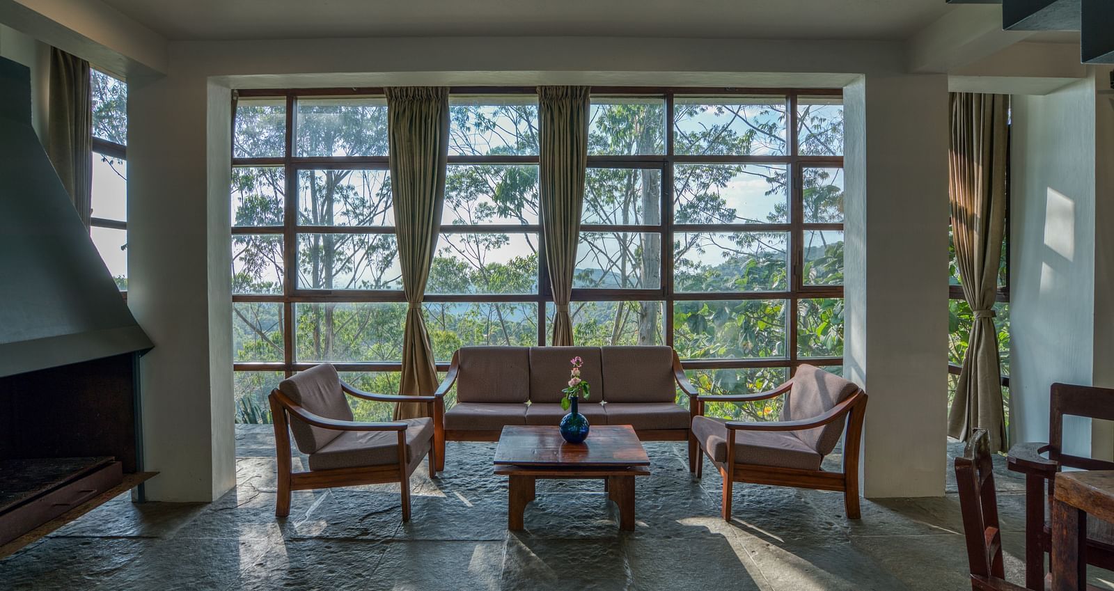Bright living area with floor-to-ceiling windows, providing ample natural light and scenic views | Mango Hill, Yercaud