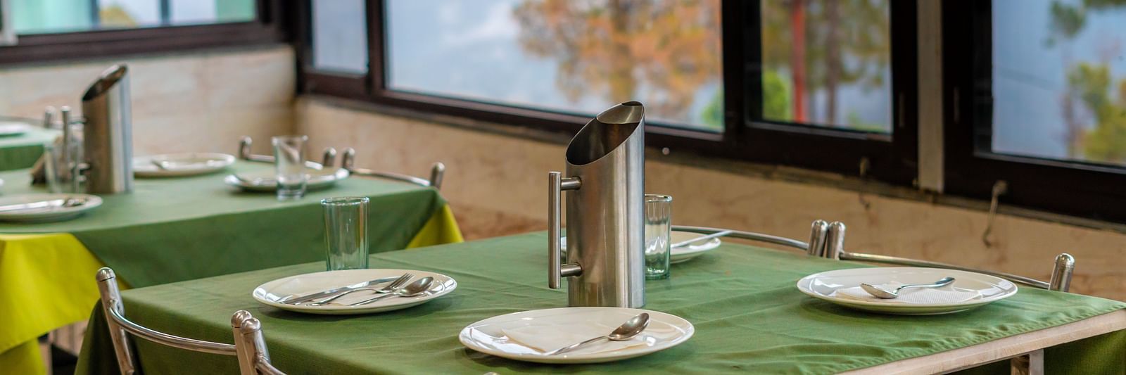 tables at Flutter Hotels & Resorts featuring dishes placed on it