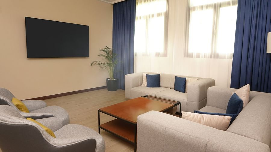 overview of the living room inside the Deluxe Apartment - La Maison Hotel, Doha