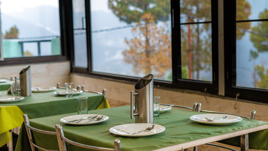 tables at Flutter Hotels & Resorts featuring dishes placed on it