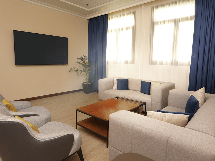 Overview of the living room inside Deluxe Apartment - La Maison Hotel, Doha