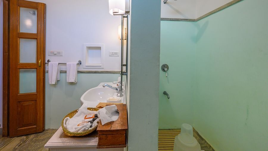 Deo Bagh - 17th Century, Gwalior - the washroom of one of the rooms with hand towels hanging in one corner