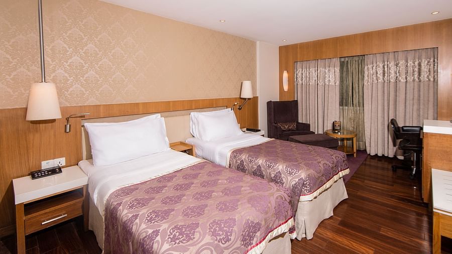 room with twin beds at hotel bawa international