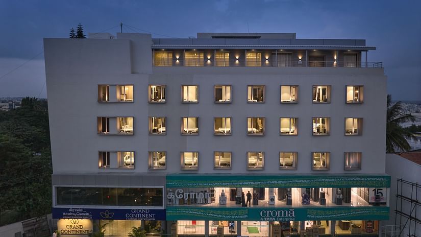Facade view with all the lights on inside the hotel - Grand Continent - A Sarovar Premiere Affiliate Hotel, Hosur