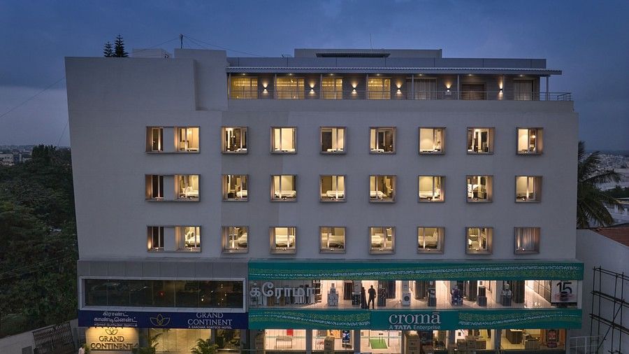 Facade view with all the lights on inside the hotel - Grand Continent - A Sarovar Premiere Affiliate Hotel, Hosur