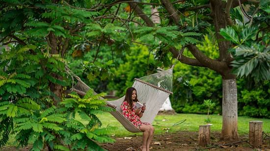 a woman sitting in the garden