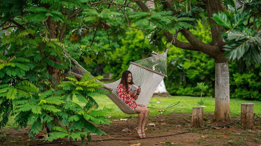 a woman sitting in the garden