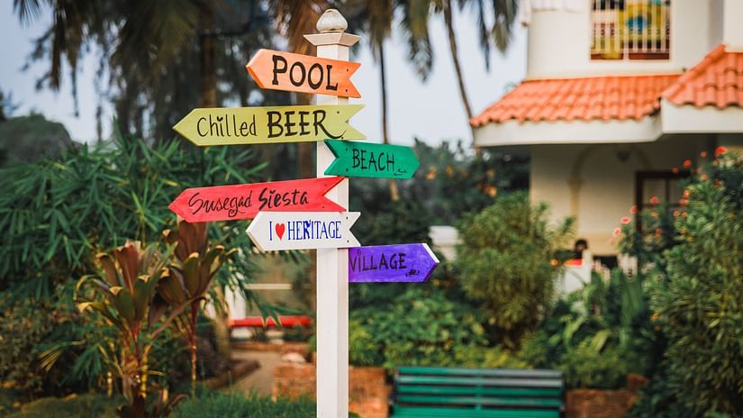 Signpost showing different places at Heritage Village Resort & Spa, Goa