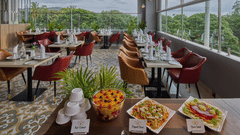 An image of our restaurant with food placed on the front table and our dining area in the background