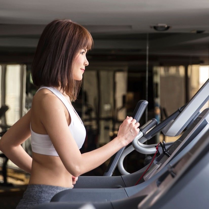 a woman excercising on a treadmill