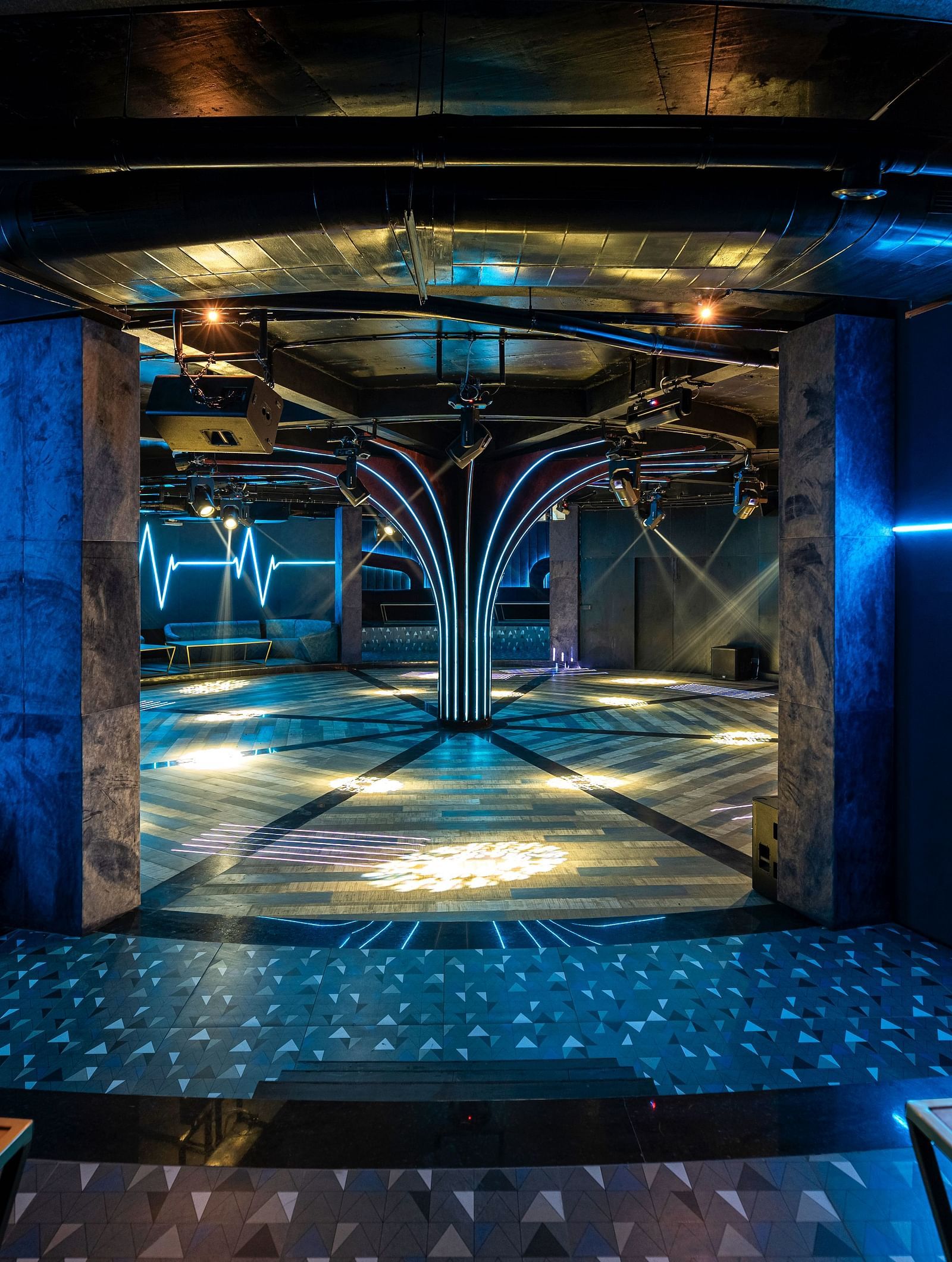 Verve showcasing a modern elevator interior with decorative lighting, mirrored walls, and a sleek design at The Qualia Resort Club & Brewery, Udaipur.