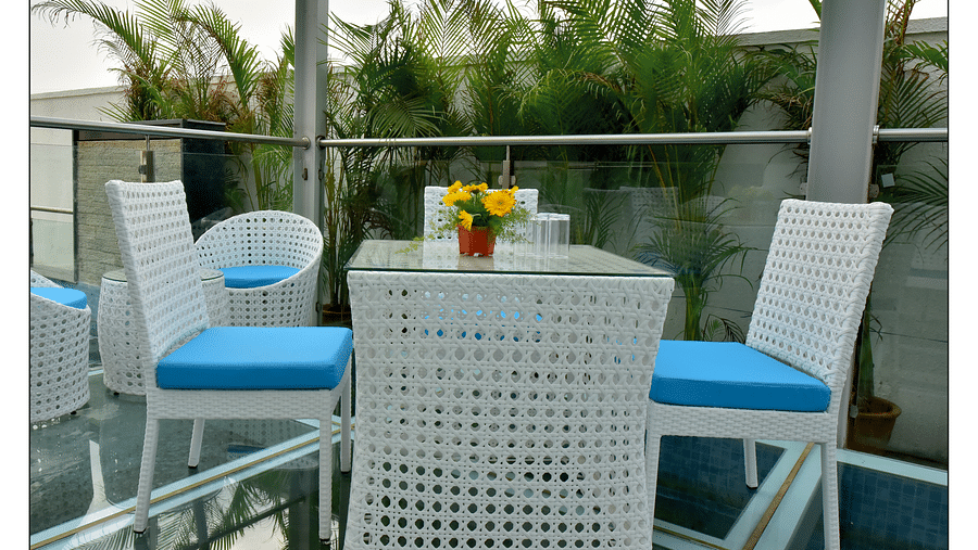 blue and white themed restaurant dining area of Lily restaurant offering outdoor dining experience - Royal Lotus View Resotel1