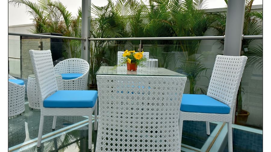blue and white themed restaurant dining area of Lily restaurant offering outdoor dining experience - Royal Lotus View Resotel1