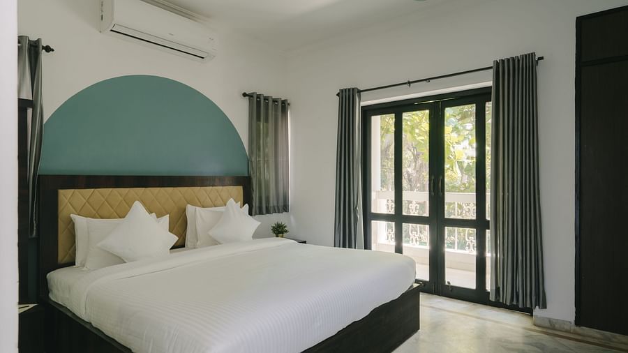 Open and airy bedroom with scenic outdoor views in the Three BHK Deluxe Villa at Richmonde Ananta Elite, Goa.