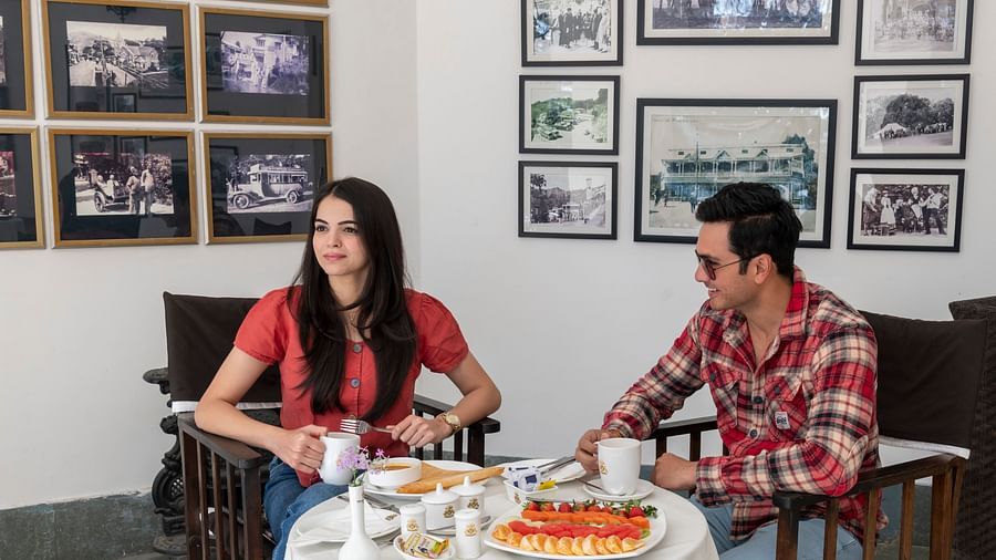 image of two people sitting across a table well kept with different dishes