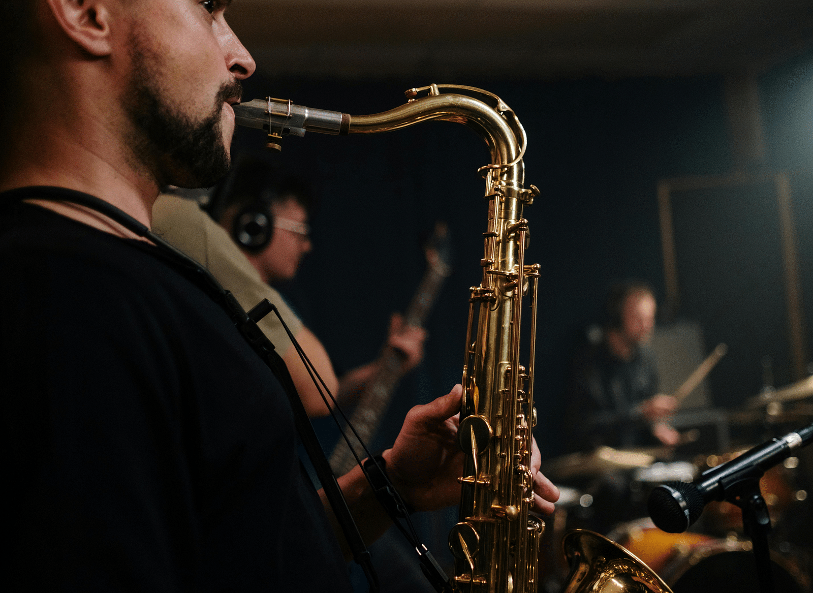 Close-up view of a person playing the saxophone.
