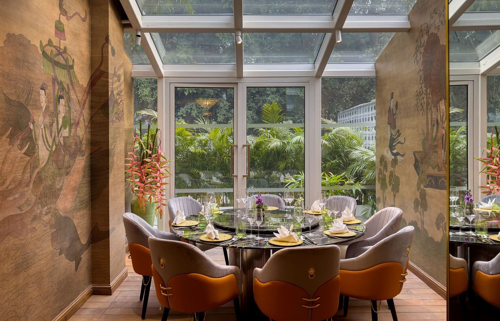 Image of Jade with glass ceiling and seating area at The Claridges New Delhi