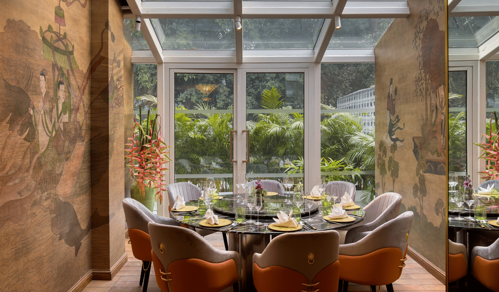  image of dining area with windos above and in front of it providing amazing dining experience at the claridges new delhi
