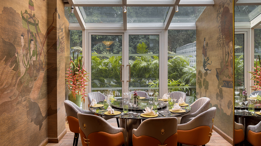  image of dining area with windos above and in front of it providing amazing dining experience at the claridges new delhi