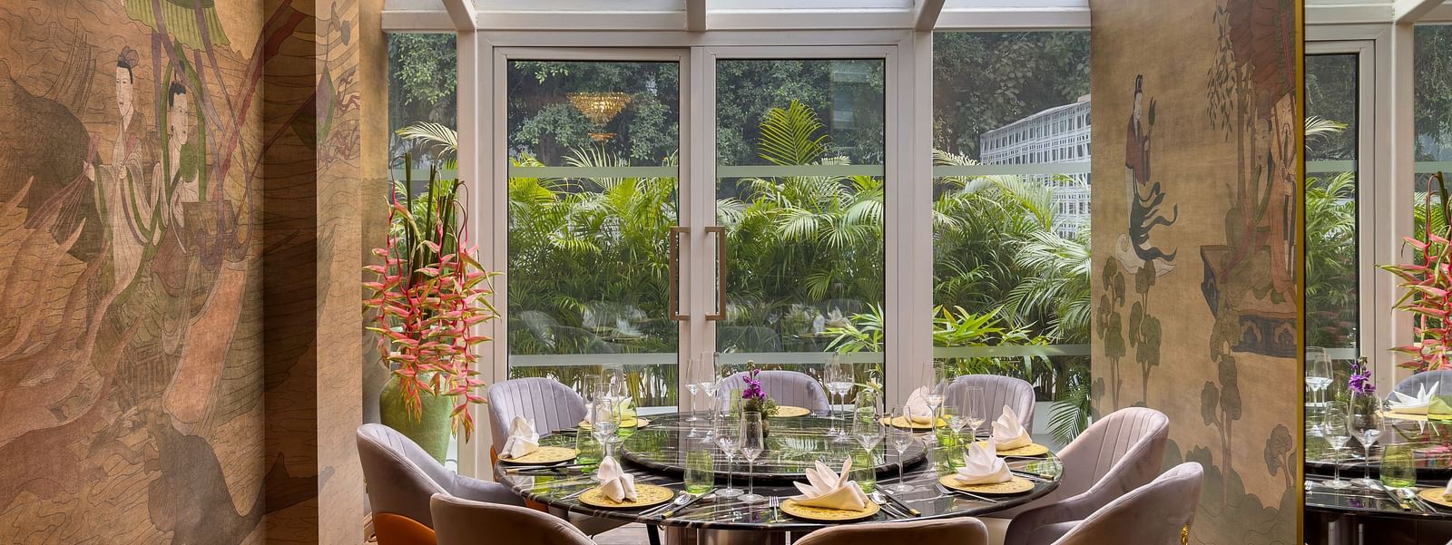 Image of Jade with glass ceiling and seating area at The Claridges New Delhi