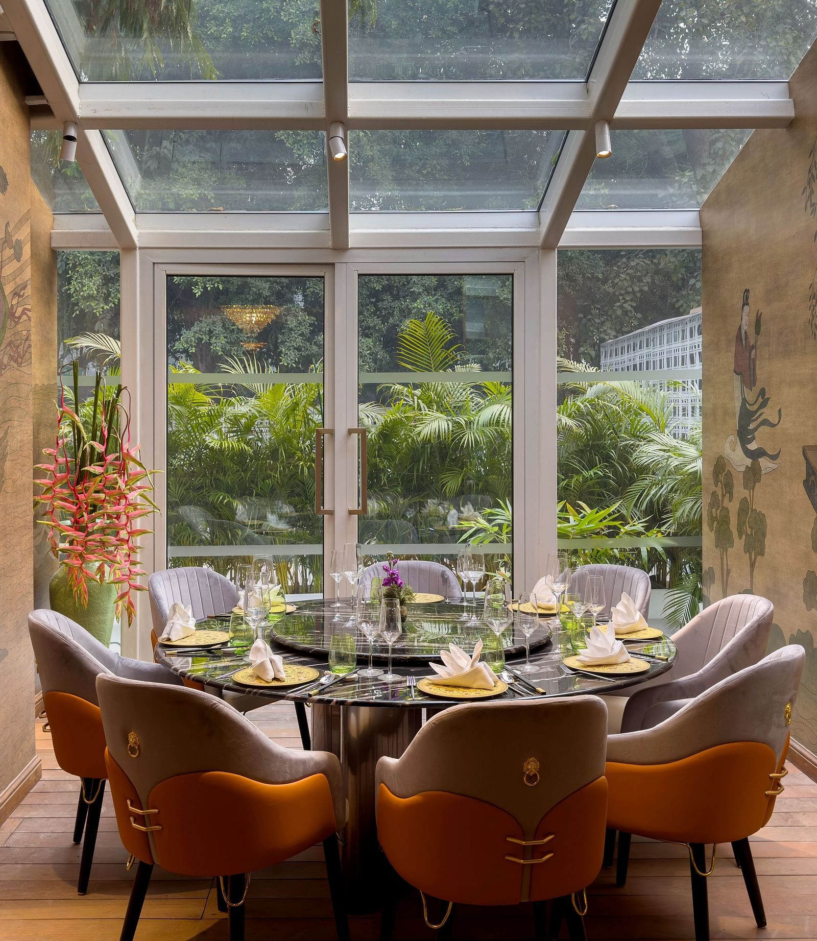  image of dining area with windos above and in front of it providing amazing dining experience at the claridges new delhi
