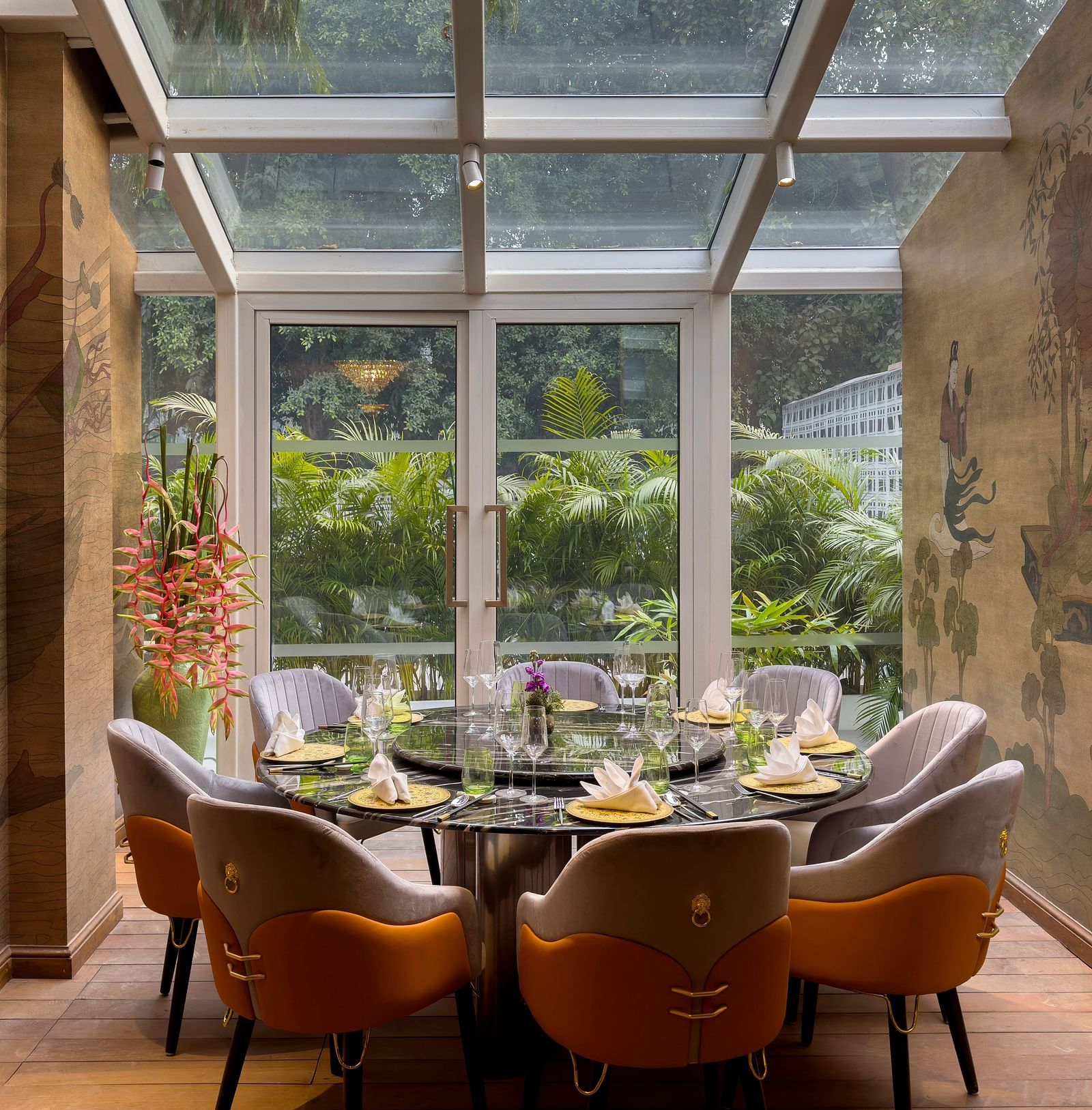 Image of the dining area with windows above and in front, offering a delightful dining experience - The Claridges New Delhi