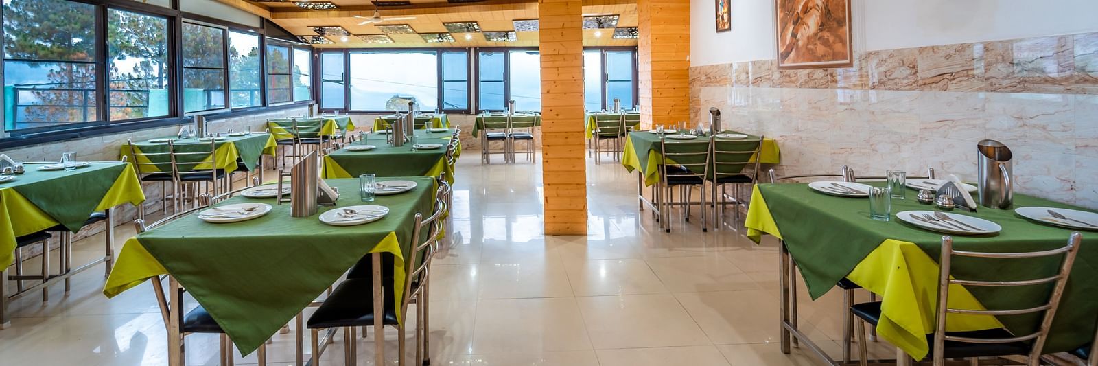 interior of the restaurant at Flutter Hotels & Resorts featuring table and chairs