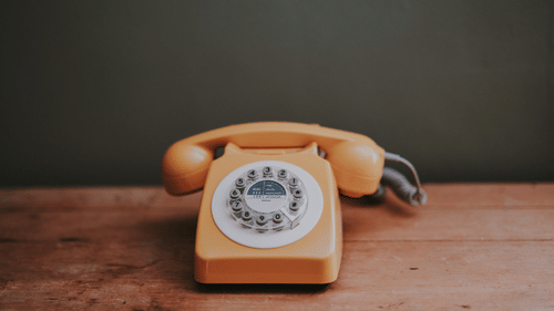an orange telephone