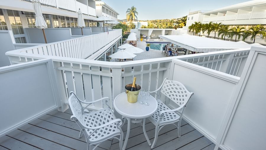 two chairs and a table at the private sit-out - The Soco House
