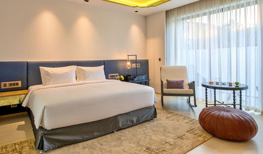 alt-text Bedroom interiors with blue, brown and white tones
