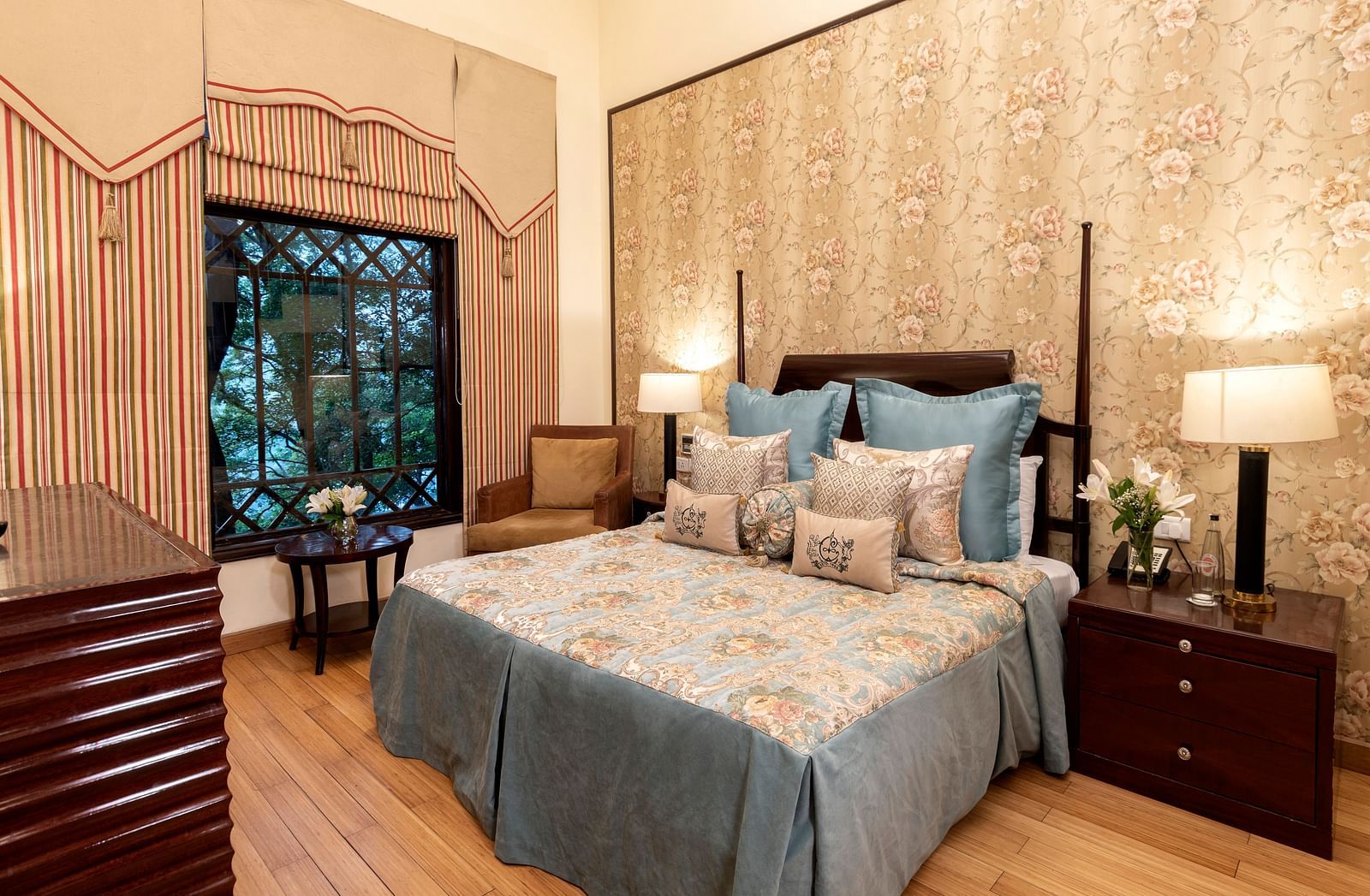 image of a king size bed with a window in Duplex Family Suite at The Claridges Nabha Residence