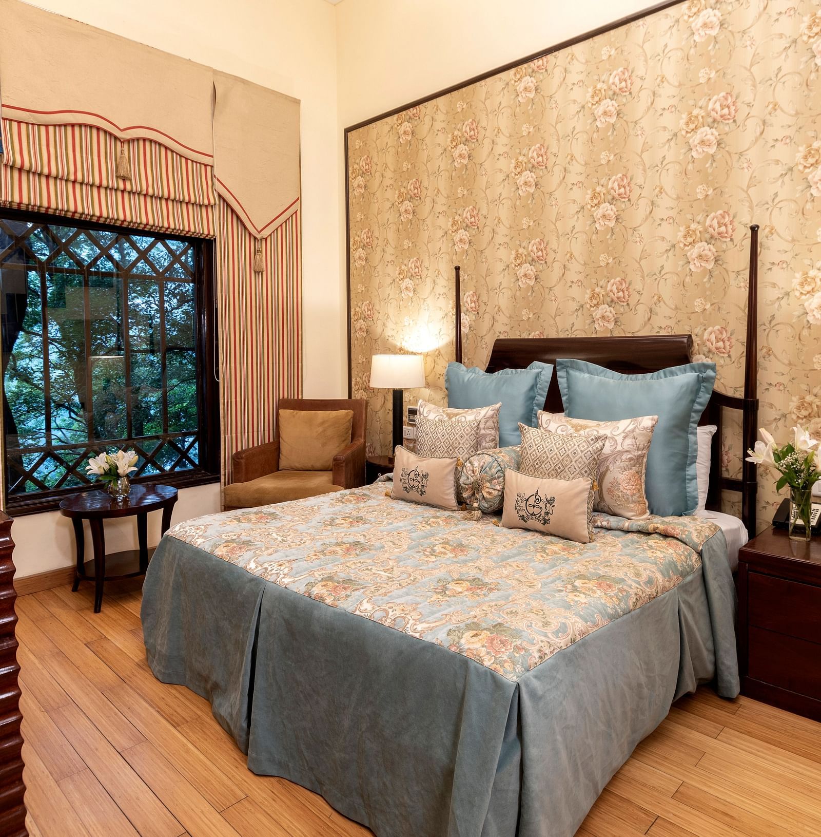 image of a king size bed with a window in Duplex Family Suite at The Claridges Nabha Residence