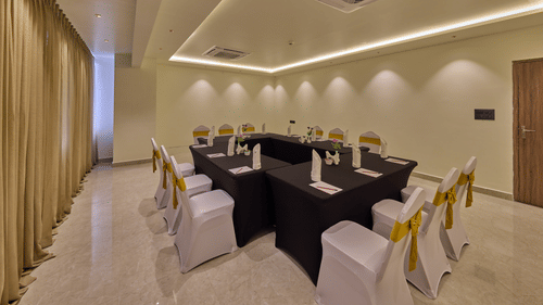 A round table style eating arrangement in our brightly lit banquet hall in Mysore