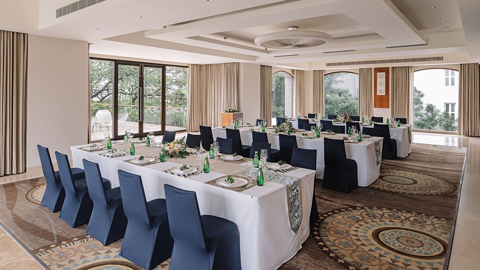 A beautifully arranged meeting room with natural light, ideal for corporate conferences at The Raintree, St. Mary's Road.
