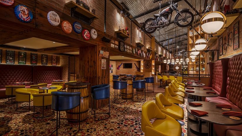 Bike Barrel in-house bar with rustic and vintage motorcycle décor at The Residency Towers Puducherry