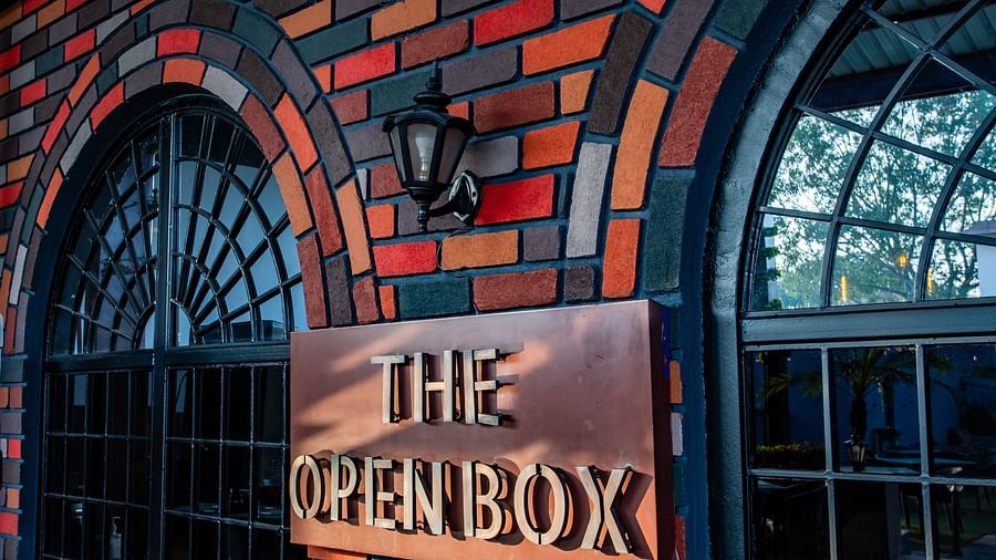the openbox signage on the wall next to the windows - Wedlock Greens Hotel Resorts Dhanbad