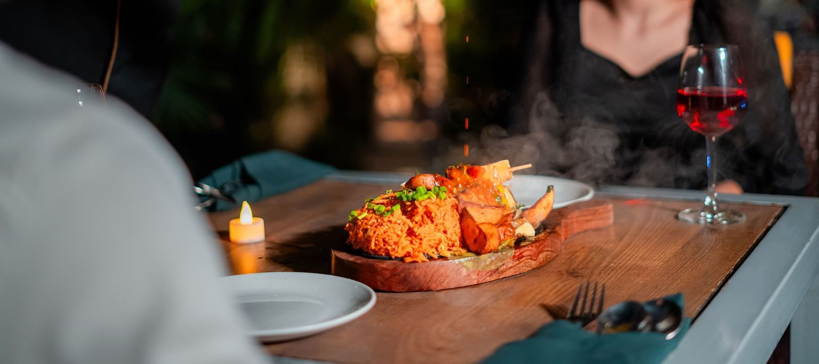 A chef attending to a couple by the poolside, creating a memorable dining experience at Crescent Spa & Resort, Indore