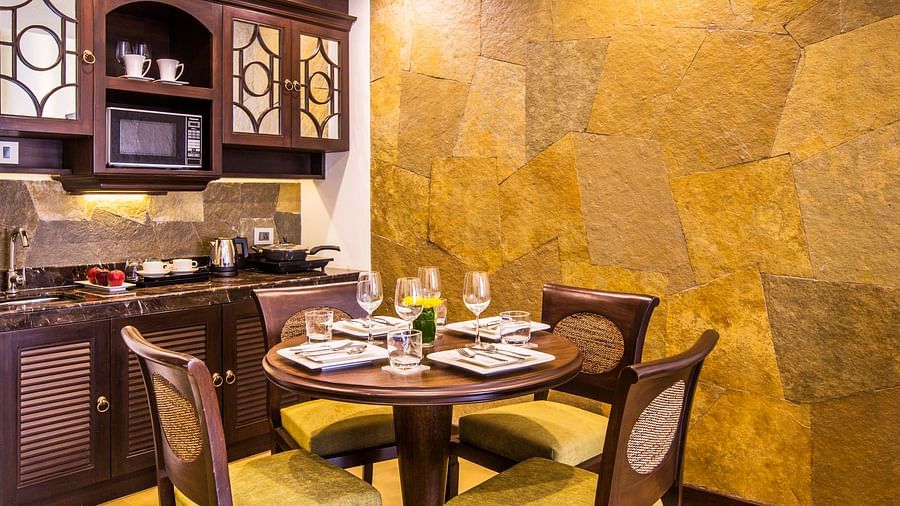 an image of a kitchen with open dining area inside one of our rooms - Rhythm Lonavala