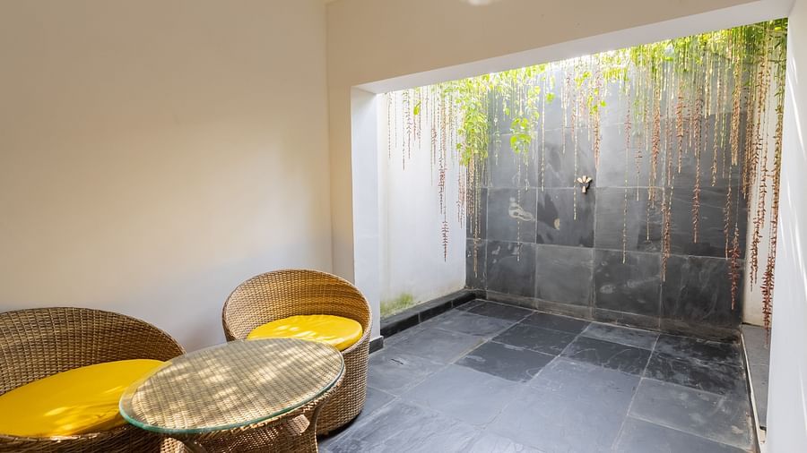 image of the exterior part of the garden room featuring a sheltered private sit out area - Darza Resorts