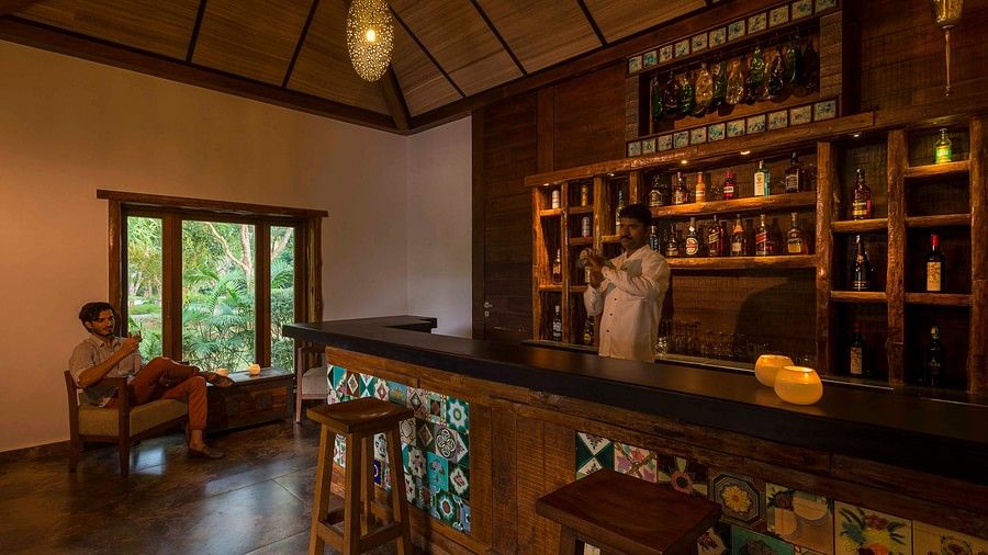An overview of the seating arrangement at Outpost the Bar at The Serai, Kabini.