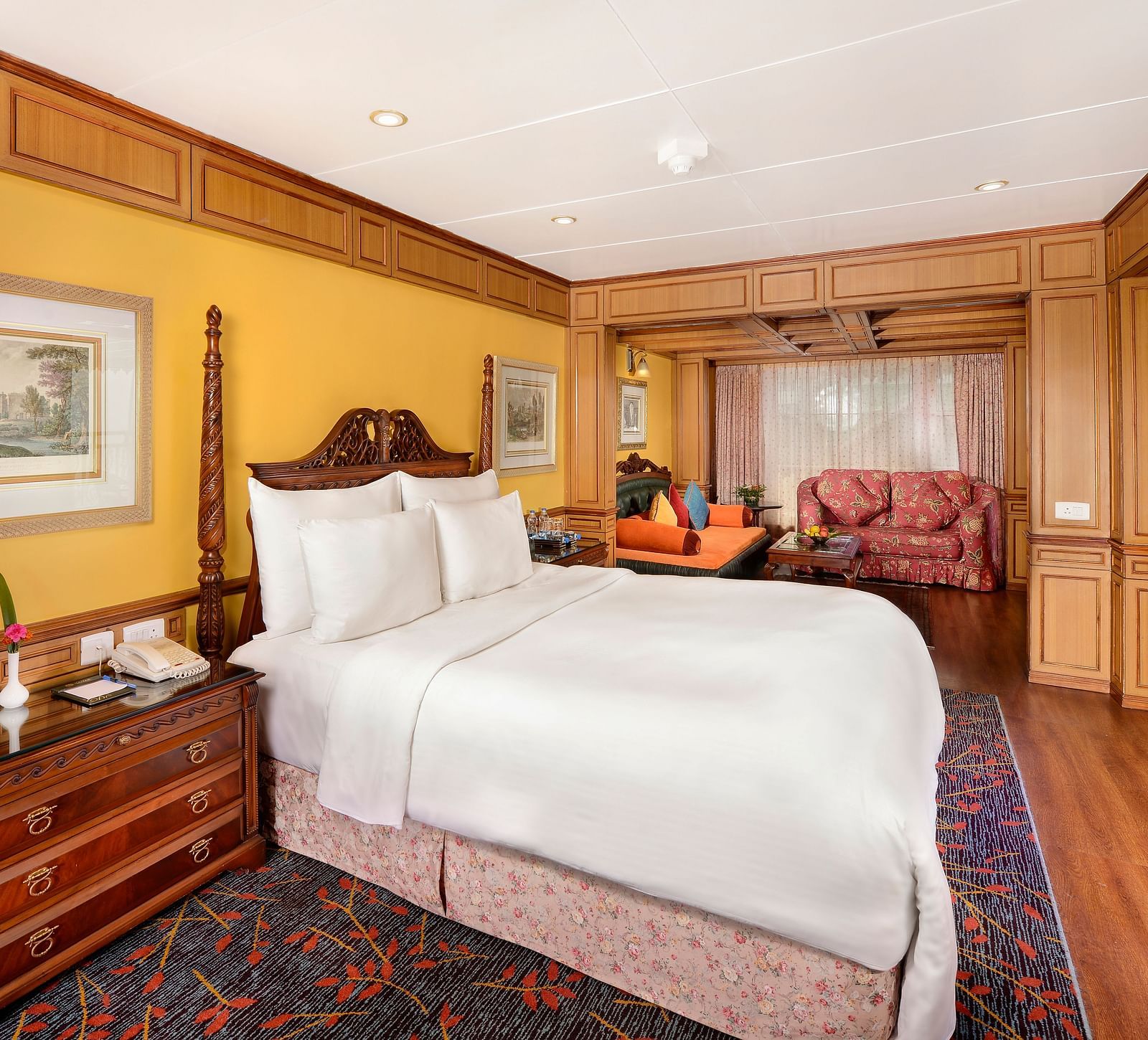 view of the king size bed and a bedside table - Mayfair Himalayan Spa Resort Kalimpong