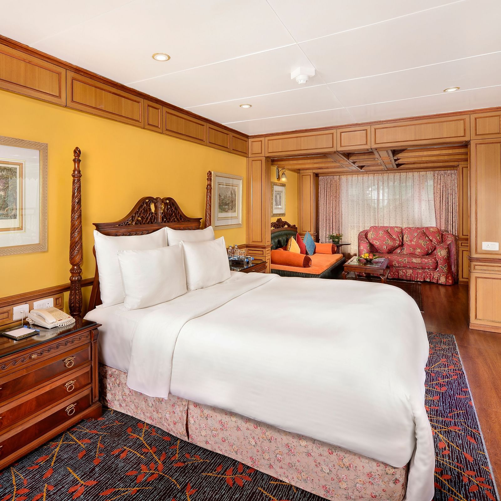 view of the king size bed and a bedside table - Mayfair Himalayan Spa Resort Kalimpong