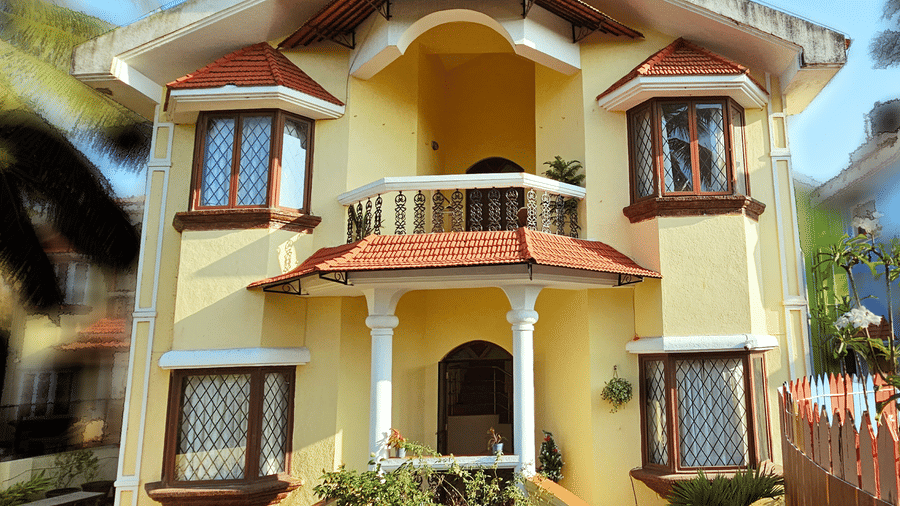 A bright exterior shot of the Amara Villa, Nagoa, featuring a beautiful entrance.