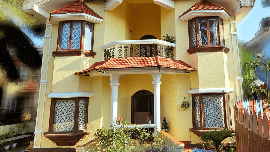 A bright exterior shot of the Amara Villa, Nagoa, featuring a beautiful entrance.