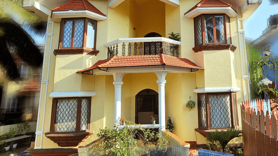 A bright exterior shot of the Amara Villa, Nagoa, featuring a beautiful entrance.